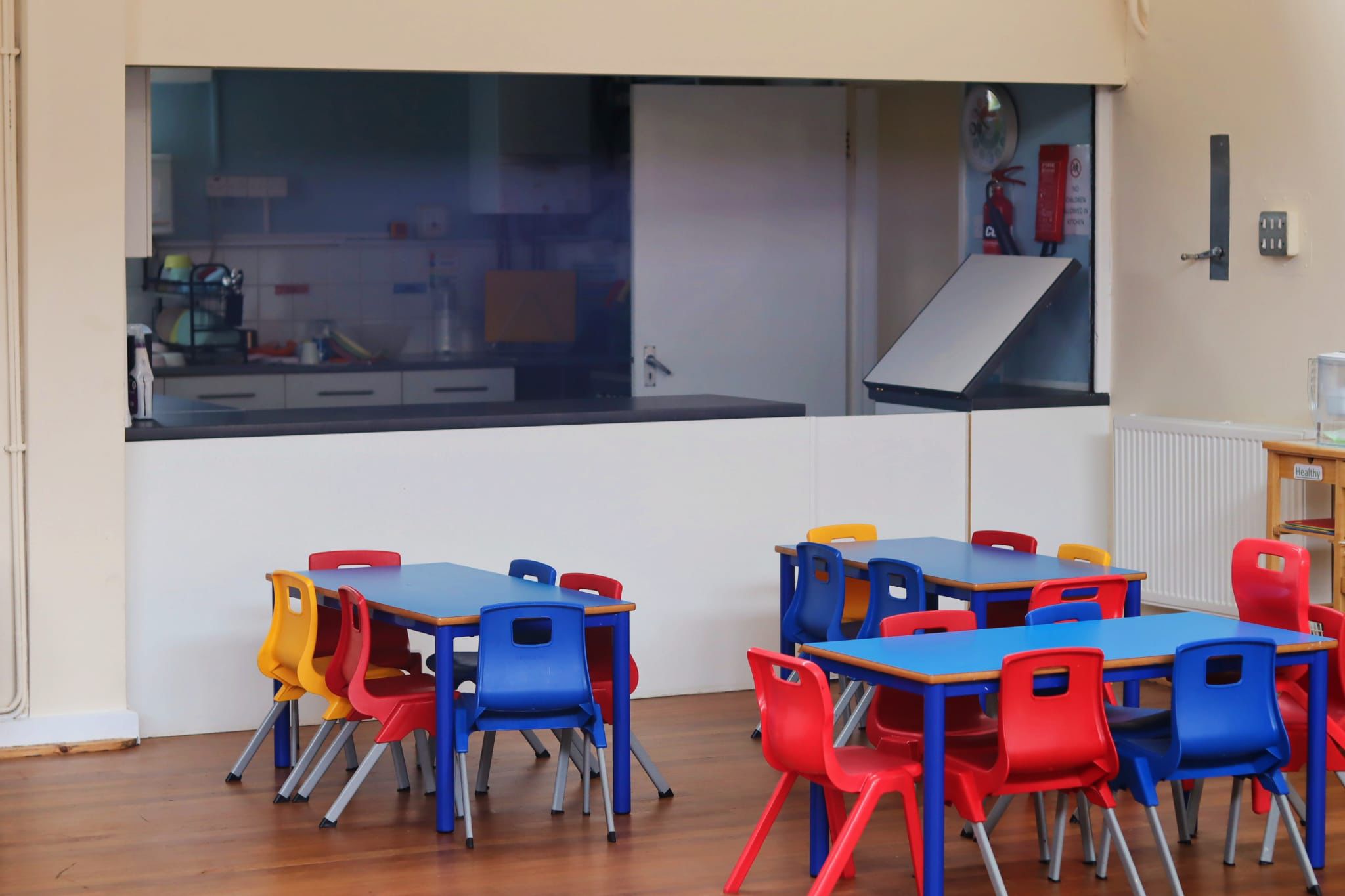 Colourful dining hall and kitchen at Maygardens Little Learners nursery Northolt