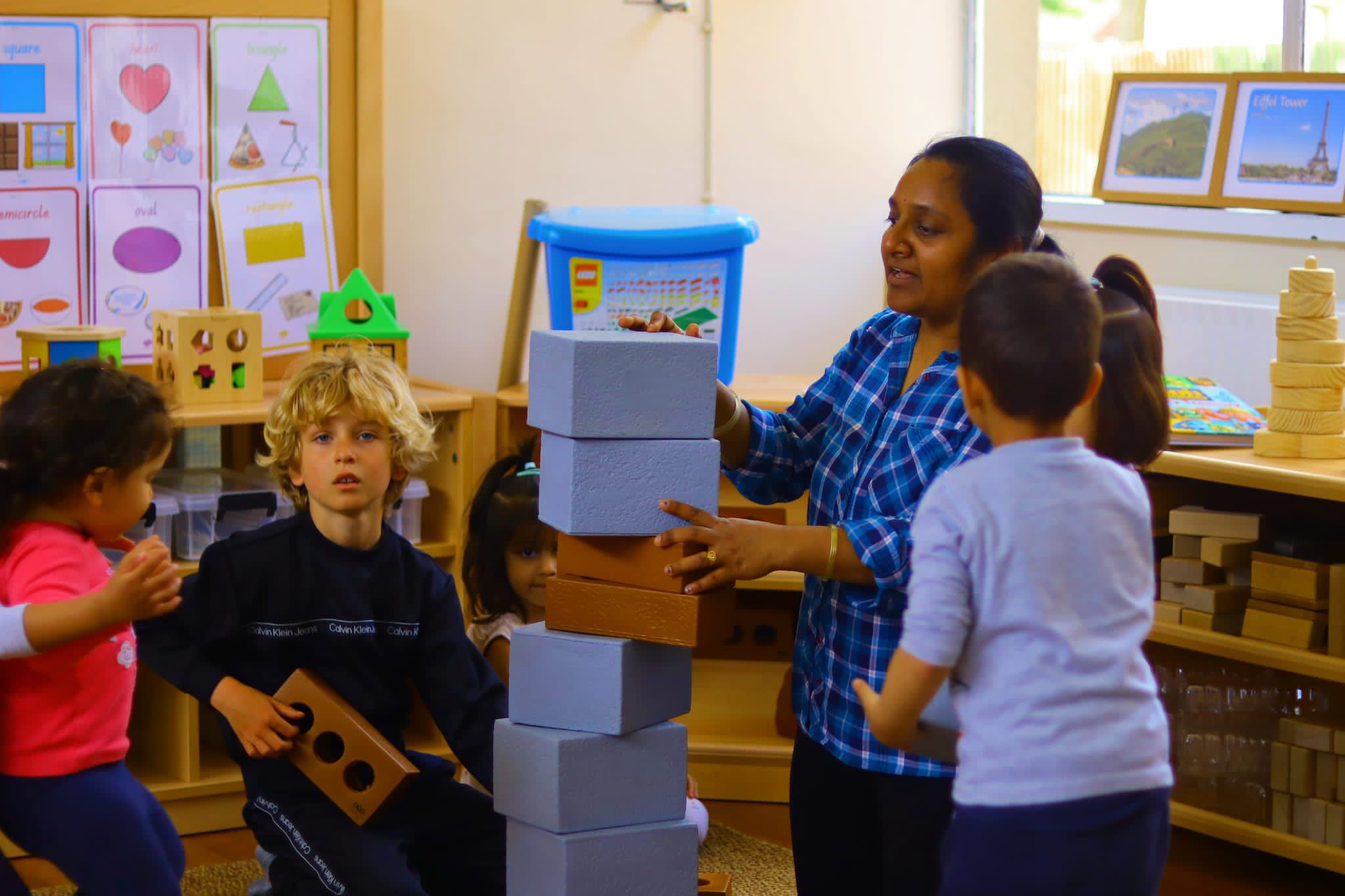 Staff and children enjoying learning activities at Maygardens Little Learners nursery Northolt